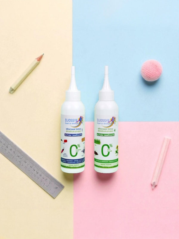 Deux détachants textiles (n°1 pour taches spécifiques comme goudron ou maquillage, n°4 pour taches de jardinage), présentés avec des crayons et une règle